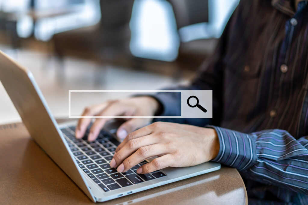 A lady typing on a computer