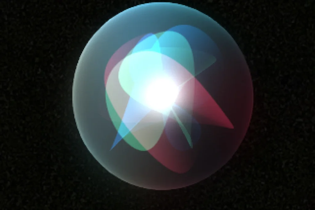 Shiny sphere with colorful light reflections on a dark background.