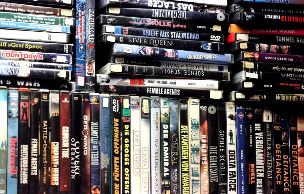 Stacked DVD movies collection.