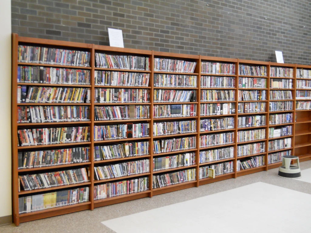 Library shelves with DVDs.