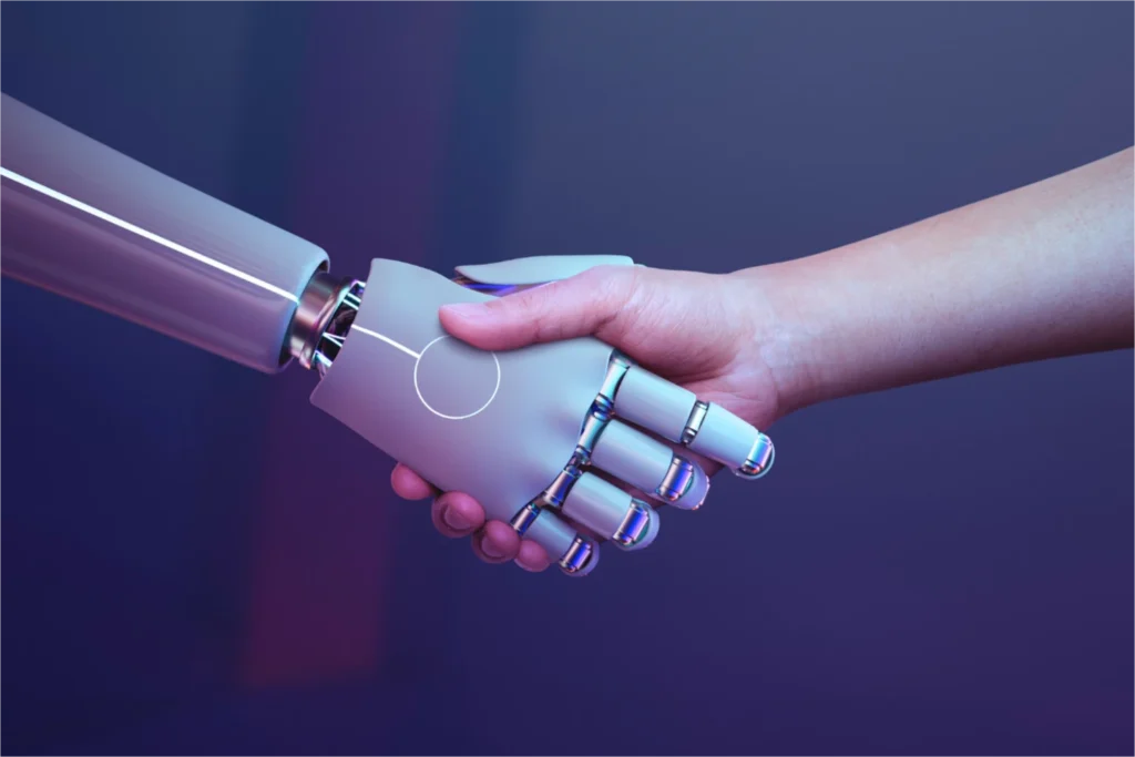 Human hand shaking robot hand.