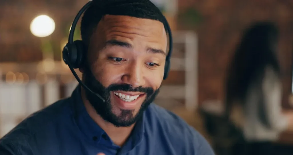 Smiling customer support agent wearing headset